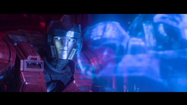 Orion Parks watches the hologram intently in Transformers One.